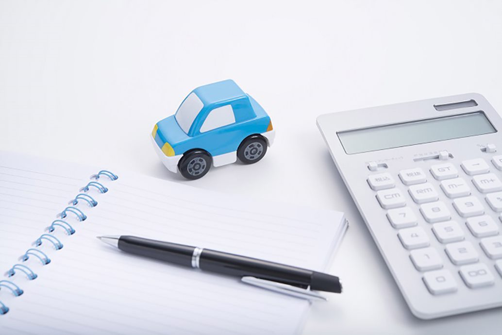 Notepad, calculator, and a toy car