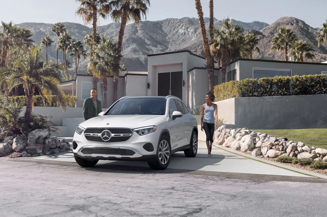 2026 Mercedes-Benz GLC SUV parked in front of house with palm trees