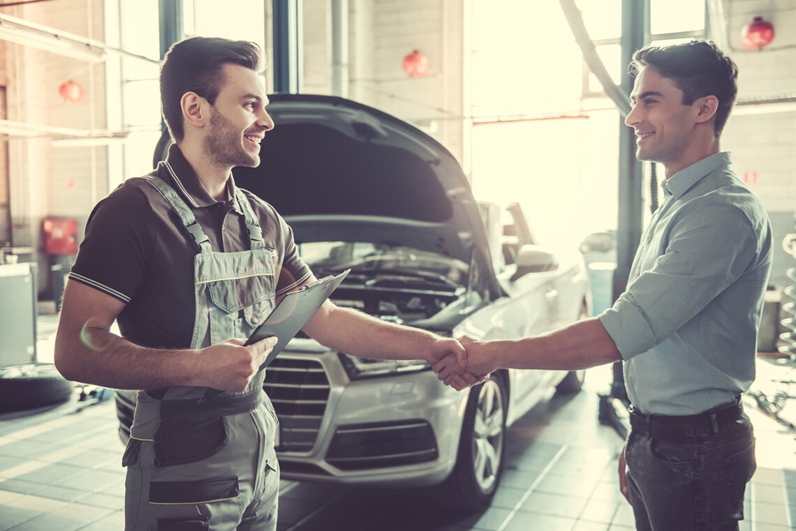 mechanic shaking hands with guest