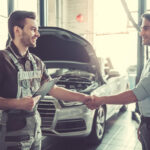 mechanic shaking hands with guest