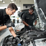 Mercedes-Benz service technicians inspecting vehicles
